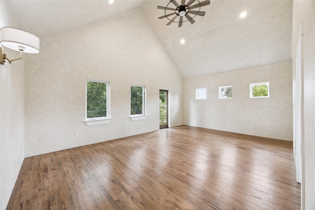 3106 W Jefferson Blvd, Dallas, TX 75211 - empty room featuring wood finished floors, a ceiling fan, high vaulted ceiling, and recessed lighting