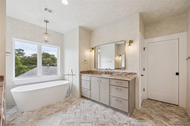 3106 W Jefferson Blvd, Dallas, TX 75211 - bathroom with vanity, a soaking tub, and brick floors