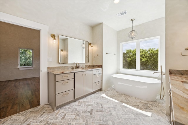 3106 W Jefferson Blvd, Dallas, TX 75211 - full bath with vanity and a freestanding tub