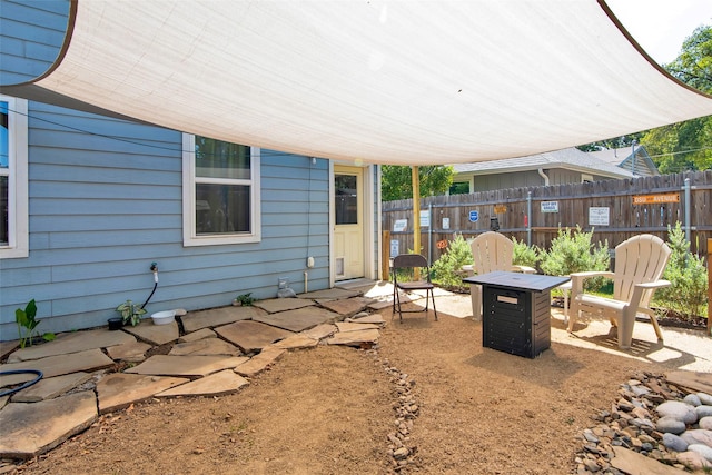 319 W Johnson St, Denison, TX 75020 - view of yard featuring a patio area and a fire pit