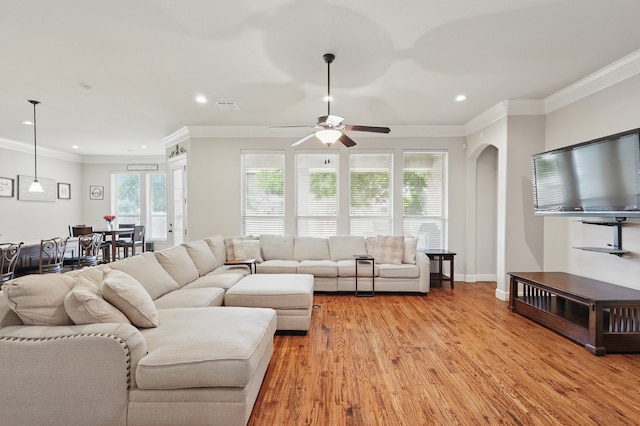 6902 Golf Green Dr, Arlington, TX 76001 - living room featuring arched walkways, recessed lighting, a ceiling fan, light wood-style flooring, and ornamental molding