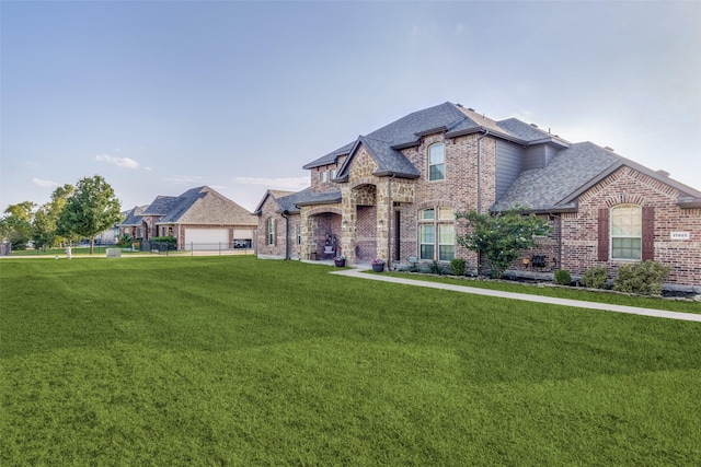 17055 Lochwood Ln, Forney, TX 75126 - french country inspired facade with brick siding and a shingled roof