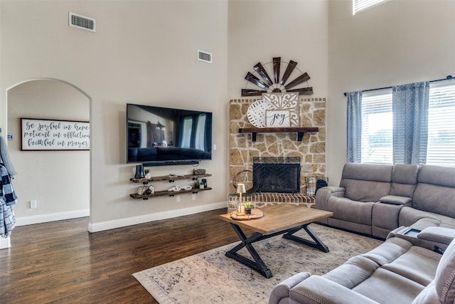 17055 Lochwood Ln, Forney, TX 75126 - living room with a towering ceiling, wood finished floors, and a stone fireplace