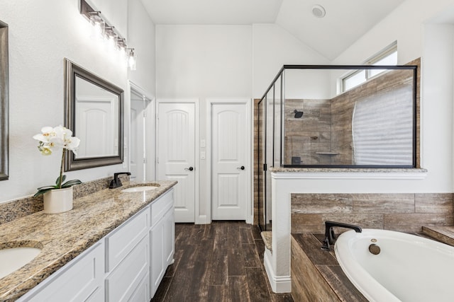 4225 Rustic Timbers Dr, Fort Worth, TX 76244 - full bath featuring a shower stall, double vanity, a bath, lofted ceiling, and wood finished floors