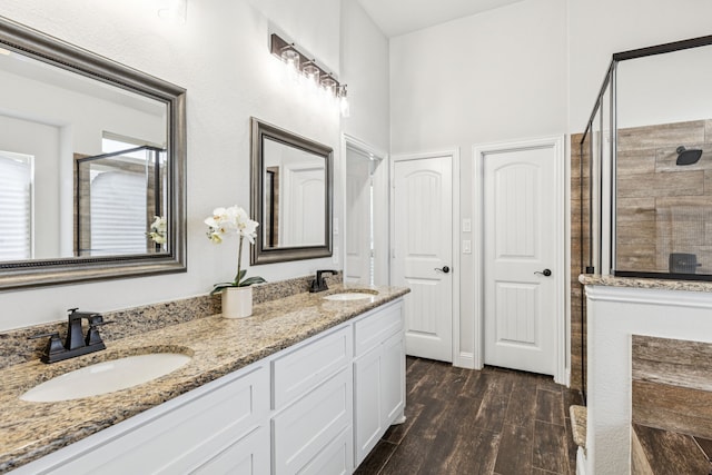 4225 Rustic Timbers Dr, Fort Worth, TX 76244 - bathroom with a shower stall, double vanity, and wood finished floors