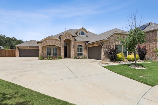 4225 Rustic Timbers Dr, Fort Worth, TX 76244 - french country style house with brick siding, an attached garage, and driveway