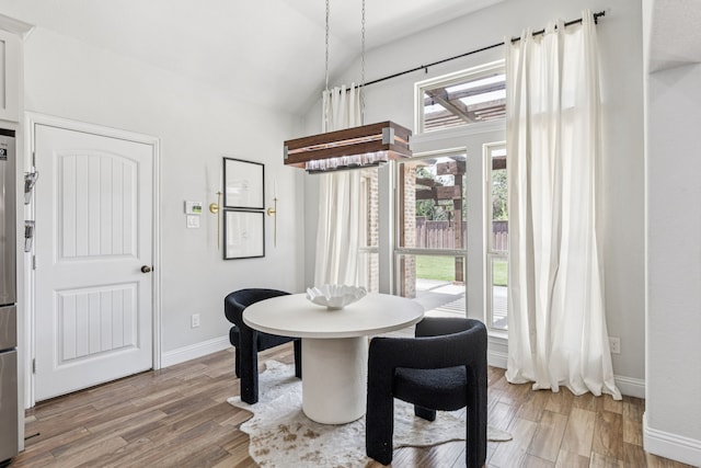 4225 Rustic Timbers Dr, Fort Worth, TX 76244 - dining area with lofted ceiling and light wood-style floors