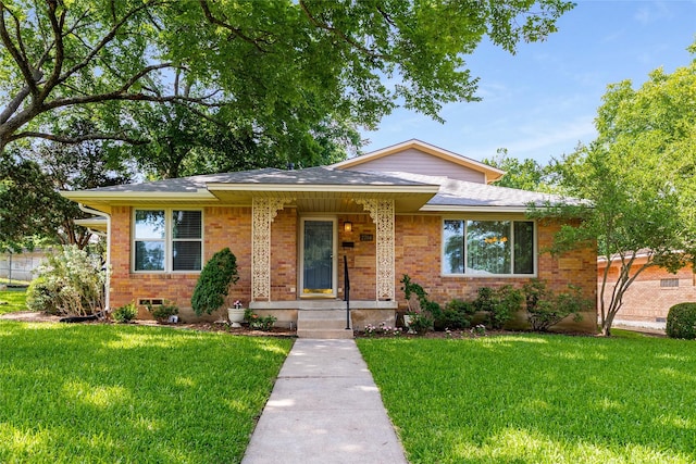 2704 Sunset Ave, Dallas, TX 75211 - view of front of house with a front yard, brick siding, and a shingled roof