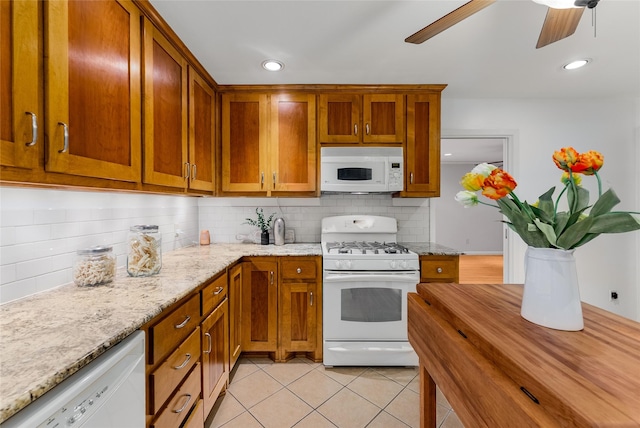 2704 Sunset Ave, Dallas, TX 75211 - kitchen featuring white appliances, ceiling fan, decorative backsplash, brown cabinets, and light tile patterned floors