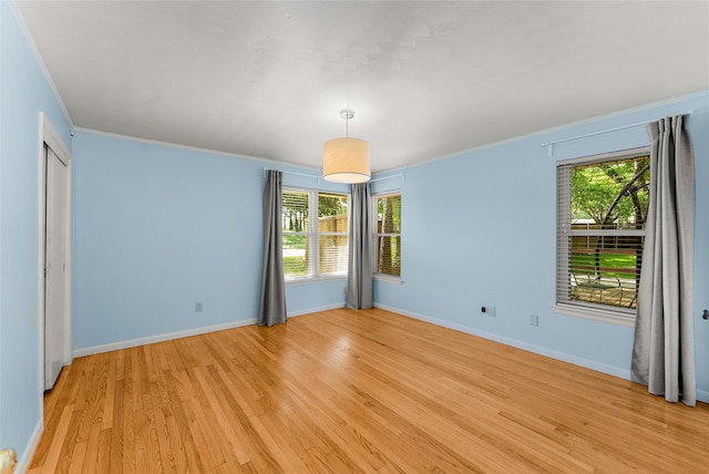 2704 Sunset Ave, Dallas, TX 75211 - spare room with healthy amount of natural light, light wood-style flooring, and ornamental molding