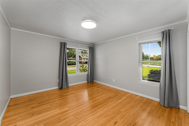 2704 Sunset Ave, Dallas, TX 75211 - unfurnished room with crown molding, healthy amount of natural light, and light wood finished floors