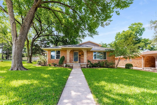 2704 Sunset Ave, Dallas, TX 75211 - view of front of property featuring a front lawn and brick siding