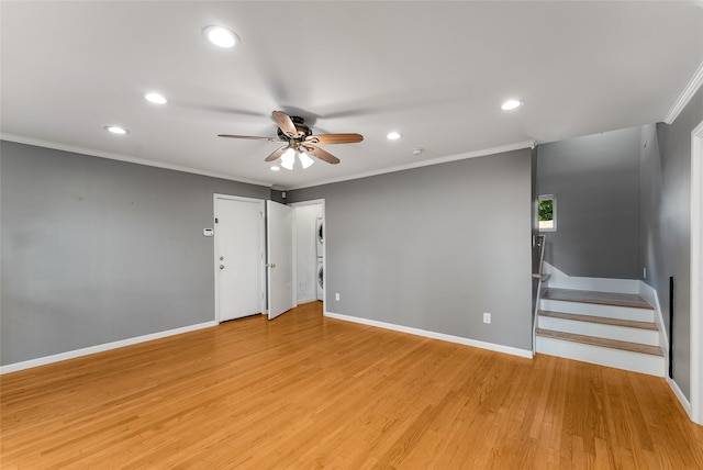2704 Sunset Ave, Dallas, TX 75211 - spare room with estacked washer and dryer, recessed lighting, ceiling fan, light wood finished floors, and crown molding