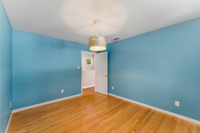 2704 Sunset Ave, Dallas, TX 75211 - spare room with baseboards and light wood-type flooring