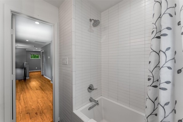 2704 Sunset Ave, Dallas, TX 75211 - bathroom with shower / bath combo with shower curtain, wood finished floors, and recessed lighting