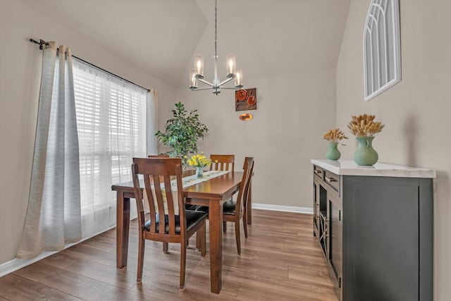 917 N Fork Ranch Rd, Waco, TX 76705 - dining space featuring a chandelier, lofted ceiling, and light wood-style flooring