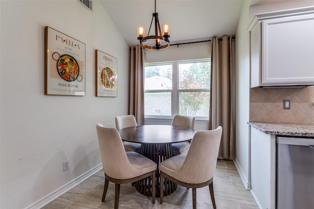 12030 Loch Ness Dr, Dallas, TX 75218 - dining space with a chandelier, light wood-style flooring, and vaulted ceiling