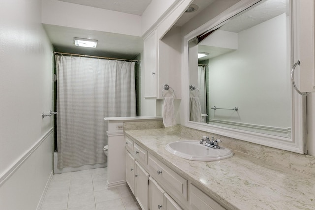 12030 Loch Ness Dr, Dallas, TX 75218 - bathroom featuring vanity, tile patterned flooring, and curtained shower