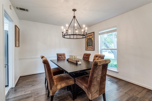 12030 Loch Ness Dr, Dallas, TX 75218 - dining space featuring wood finished floors and a chandelier