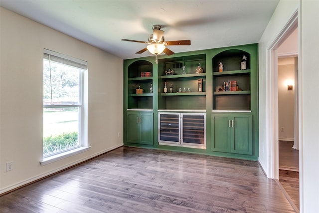 12030 Loch Ness Dr, Dallas, TX 75218 - unfurnished dining area with wood finished floors, built in shelves, and ceiling fan
