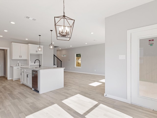 1400 Belzise Ter, Fort Worth, TX 76104 - kitchen with white cabinets, light wood-type flooring, a kitchen island with sink, hanging light fixtures, and recessed lighting