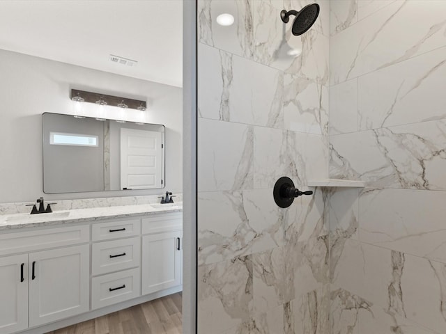 1400 Belzise Ter, Fort Worth, TX 76104 - bathroom with double vanity and a marble finish shower