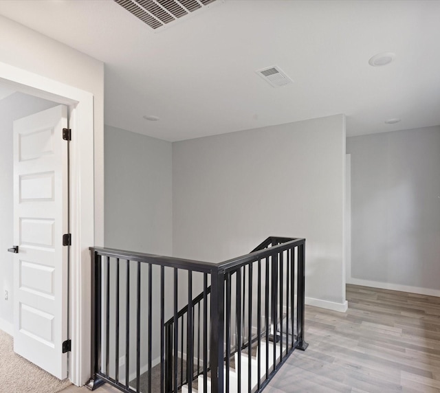 1400 Belzise Ter, Fort Worth, TX 76104 - hallway featuring an upstairs landing and light wood-style flooring