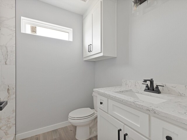 1400 Belzise Ter, Fort Worth, TX 76104 - bathroom featuring vanity, wood finished floors, and a shower