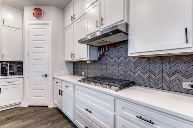 735 Red Fork Dr, Lewisville, TX 75056 - kitchen with under cabinet range hood, stainless steel gas cooktop, white cabinets, light countertops, and backsplash