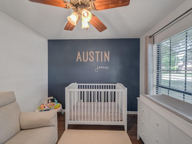 3717 Fairhaven Dr, Fort Worth, TX 76123 - bedroom with dark wood-style floors, a nursery area, and ceiling fan