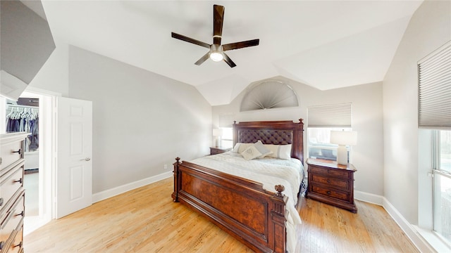 3009 Wood Trl, Flower Mound, TX 75022 - bedroom featuring light wood-style floors, vaulted ceiling, a ceiling fan, and a closet