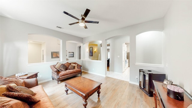 3009 Wood Trl, Flower Mound, TX 75022 - living area featuring ceiling fan, light wood-style flooring, and arched walkways