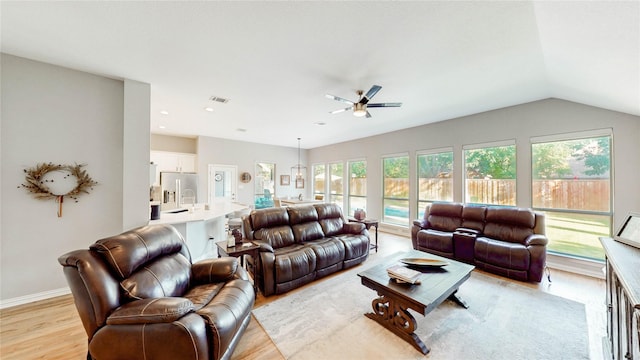 3009 Wood Trl, Flower Mound, TX 75022 - living room featuring a ceiling fan, light wood-style floors, and vaulted ceiling
