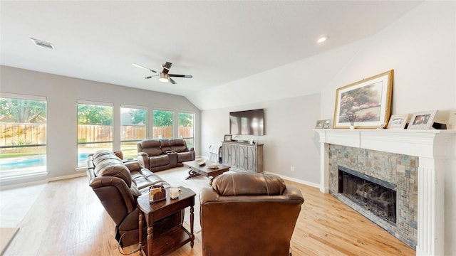 3009 Wood Trl, Flower Mound, TX 75022 - living area with a ceiling fan, a fireplace, light wood-style flooring, and vaulted ceiling