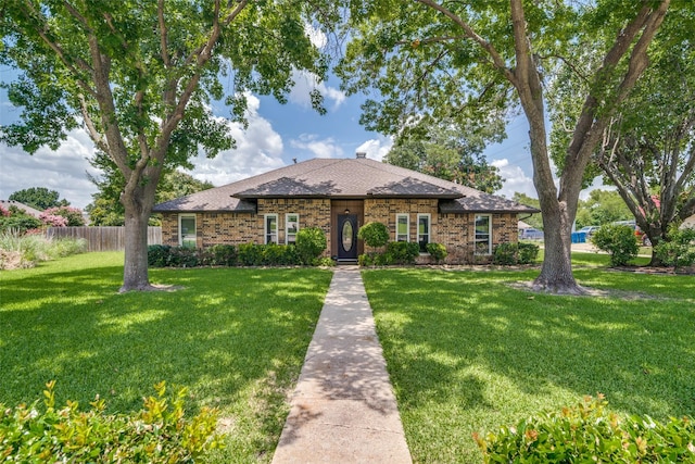 913 Lake Meadows Dr, Rockwall, TX 75087 - view of front of house featuring a shingled roof, brick siding, and a chimney