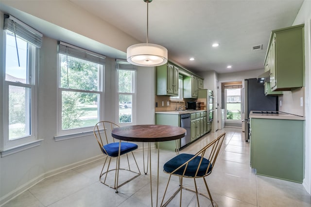 913 Lake Meadows Dr, Rockwall, TX 75087 - kitchen featuring green cabinetry, stainless steel dishwasher, light countertops, recessed lighting, and light tile patterned floors