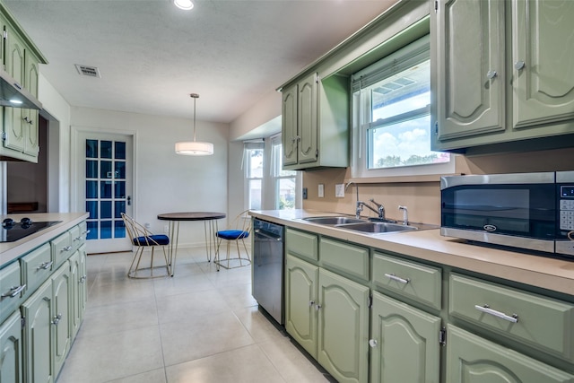913 Lake Meadows Dr, Rockwall, TX 75087 - kitchen with green cabinets, appliances with stainless steel finishes, light countertops, and pendant lighting