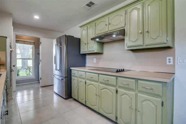 913 Lake Meadows Dr, Rockwall, TX 75087 - kitchen with green cabinetry, under cabinet range hood, black electric stovetop, high quality fridge, and light countertops