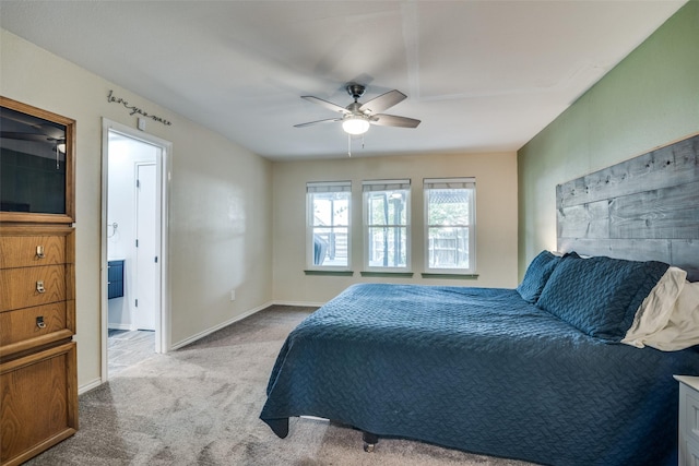 913 Lake Meadows Dr, Rockwall, TX 75087 - carpeted bedroom with baseboards and a ceiling fan