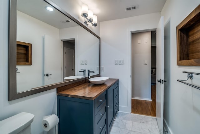 913 Lake Meadows Dr, Rockwall, TX 75087 - bathroom with vanity and marble finish floors