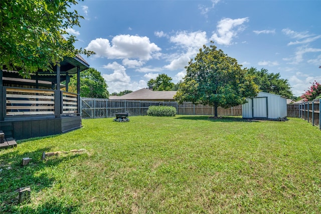 913 Lake Meadows Dr, Rockwall, TX 75087 - fenced backyard featuring a storage unit