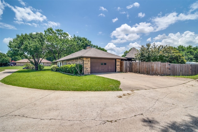 913 Lake Meadows Dr, Rockwall, TX 75087 - view of side of property with brick siding, an attached garage, and driveway