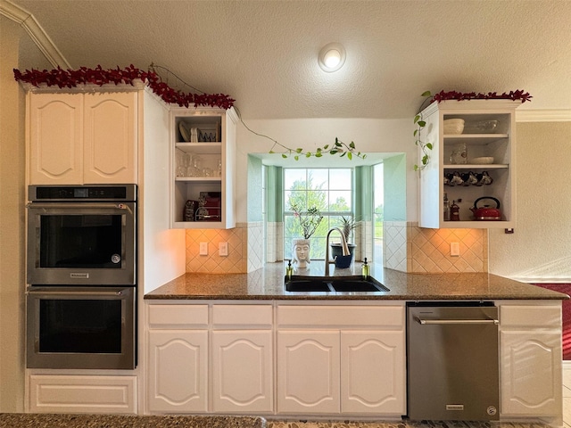 14001 Zippo Way, Fort Worth, TX 76052 - kitchen featuring open shelves, stainless steel appliances, a textured ceiling, white cabinets, and decorative backsplash
