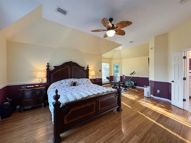 14001 Zippo Way, Fort Worth, TX 76052 - bedroom featuring wood finished floors, a ceiling fan, vaulted ceiling, and wainscoting
