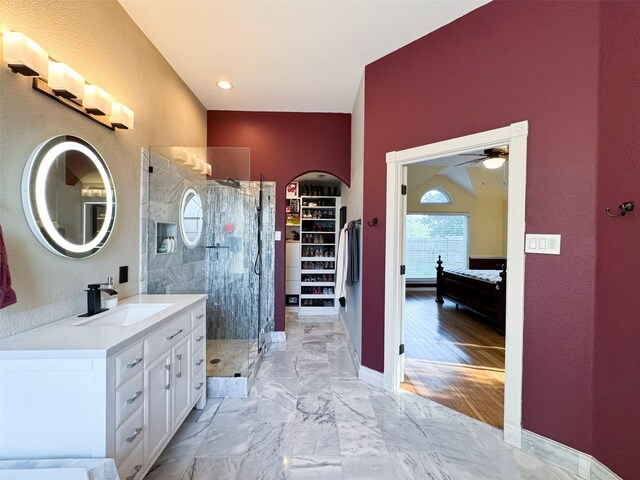 14001 Zippo Way, Fort Worth, TX 76052 - bathroom with vanity, a stall shower, ceiling fan, and a walk in closet