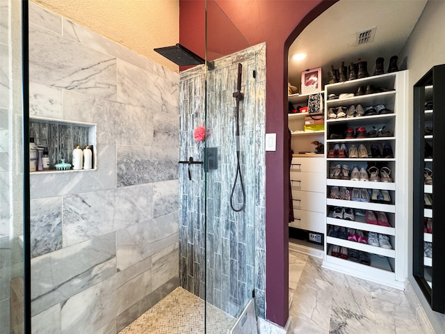 14001 Zippo Way, Fort Worth, TX 76052 - bathroom featuring walk in shower, a spacious closet, and marble finish flooring