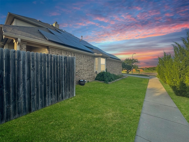 14001 Zippo Way, Fort Worth, TX 76052 - property exterior at dusk featuring roof mounted solar panels, brick siding, and a chimney