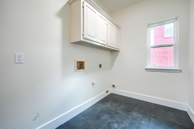 3609 Whitehaven Dr, Plano, TX 75093 - washroom featuring hookup for a washing machine, electric dryer hookup, hookup for a gas dryer, cabinet space, and dark tile patterned floors