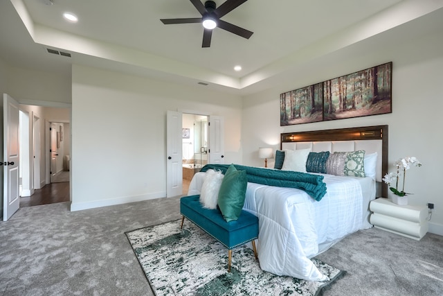3609 Whitehaven Dr, Plano, TX 75093 - carpeted bedroom with recessed lighting, a tray ceiling, ensuite bath, and ceiling fan