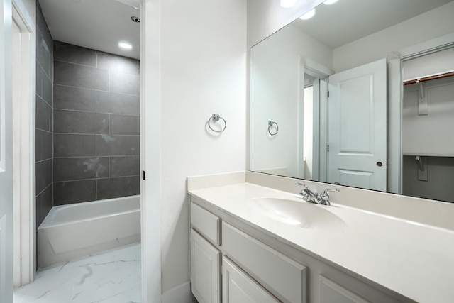 3609 Whitehaven Dr, Plano, TX 75093 - bathroom with marble look tiles, vanity, and tub / shower combination